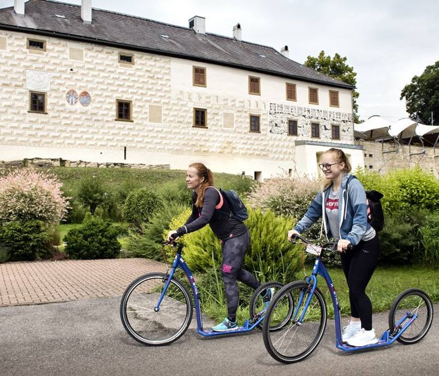 Hotel guests on scooters