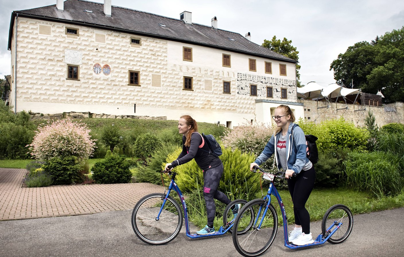 Guests on scooters at Chateau Orlice